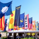 Showcasing custom flags Ireland at a vibrant festival, featuring unique designs in bright colors.